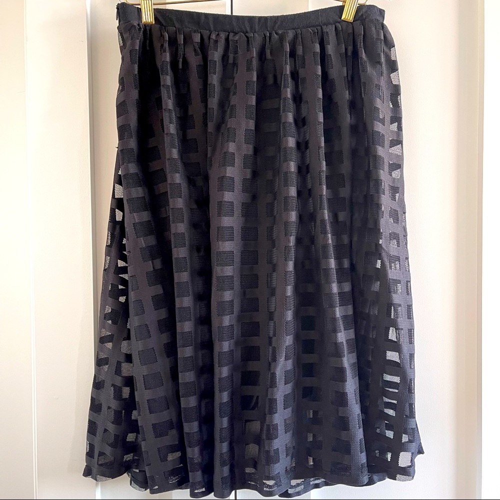 Black flowy skirt with checkered mesh overlay